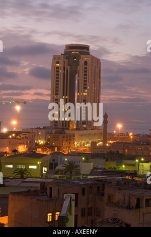 General view of the city of Tripoli by night showing the Al Fateh Tower Tripoli Libya Stock Photo