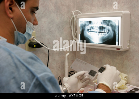 North Miami Beach Florida,Kmart,Dental Office,Hispanic spanish,man men male,assistant,x rays,man men male,teeth,mouth,jaw,FL061115003 Stock Photo