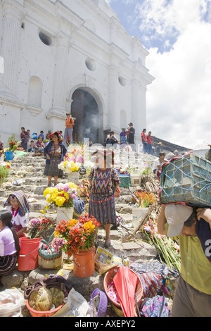 GUATEMALA CHICHICASTENANGO Local vendors sell everything from flowers and incense to vegetables on the steps of Santo Tomas Stock Photo