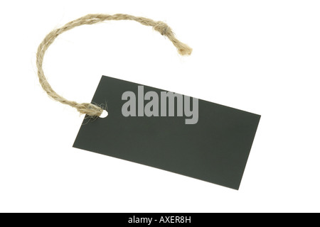 Black blank paper label with raffia string on white background Stock Photo