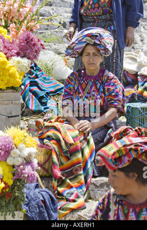 GUATEMALA CHICHICASTENANGO Local vendors sell everything from flowers and incense to vegetables on the steps of Santo Tomas Stock Photo