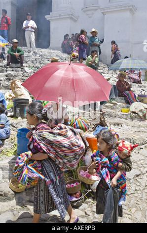 GUATEMALA CHICHICASTENANGO Local vendors sell everything from flowers and incense to vegetables on the steps of Santo Tomas Stock Photo