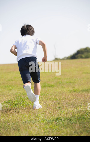 Boy (4-5) running Stock Photo - Alamy