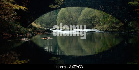 Clappersgate Bridge, Reflection in the River Brathay, near Ambleside, Lake District National Park, Cumbria, England, UK Stock Photo