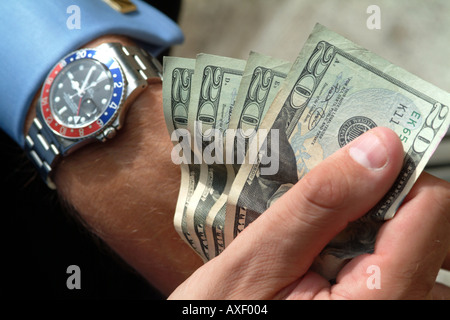 Fistful of US 20 Twenty Dollar Bills or notes and GMT Master Rolex