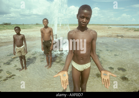 Africa Namibia Ovamboland Boys play in water Stock Photo