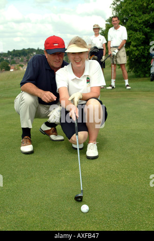 Senior players on the golf course husband and wife Stock Photo