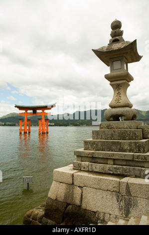 The floating torii gate of Miyajima stands in the bay near the Itsukushima Shrine Stock Photo