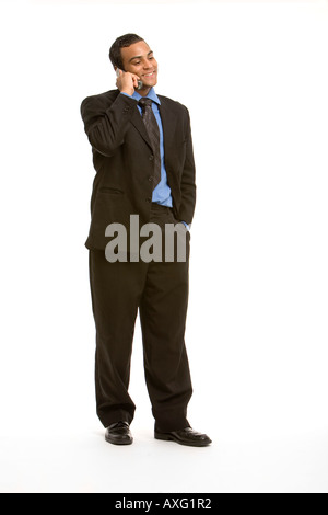 Young business man smiling while talking on the phone Stock Photo