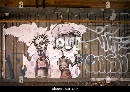 Graffiti in a brownfield site factory, at Vichy (France). Graffiti dans une usine désaffectée de Vichy (Allier - France). Stock Photo