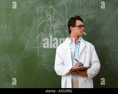 Man in Lab Coat Smoking Stock Photo