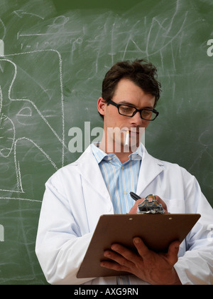 Man in Lab Coat Smoking Stock Photo