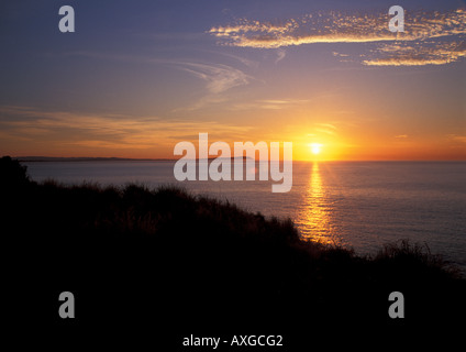 Sunrise over Phillip Island south of Melbourne, Australia with refelction on the water from the sun Stock Photo