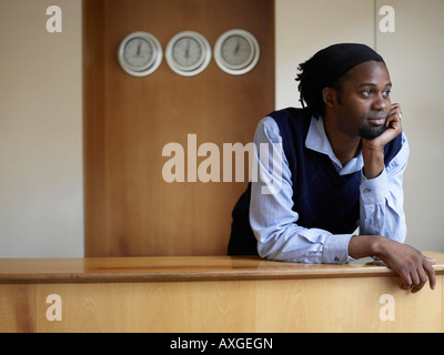 Portrait of Man Behind Desk Stock Photo