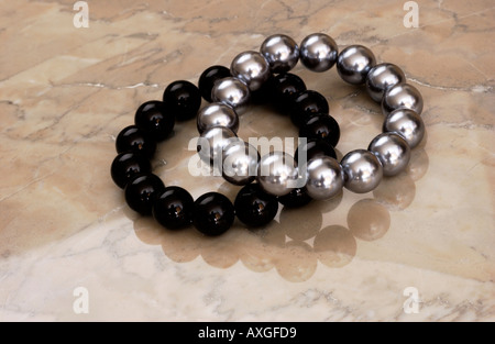 Bracelets on Marble Background Stock Photo