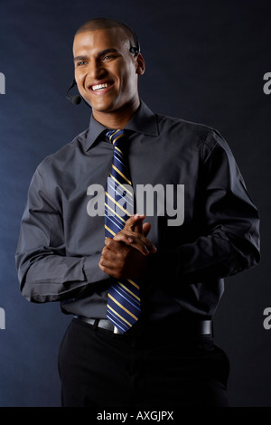Happy Businessman Wearing Headset Stock Photo