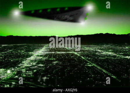 Night vision image of UFO sighting over city. Stock Photo