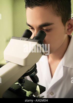 Scientist Using Microscope Stock Photo