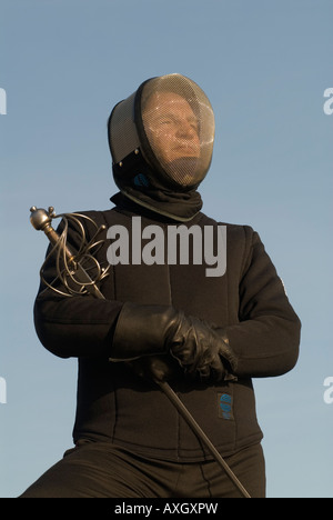 Swordplay Andrew Feest face mask and rapier sword Sussex UK 2007 Stock Photo