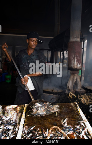 Tanzania Dar es Salaam Kivukoni fishmarket fish is fried in big kettles Stock Photo