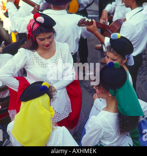Group of four young girls in traditional costume at Canary Village Las Palmas Gran Canaria Island The Canary Islands Stock Photo