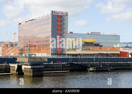 Reflection of shipyard crane in mirrored building Stock Photo