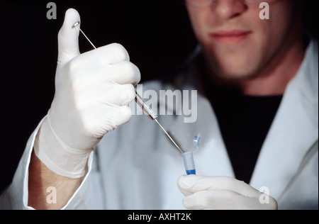 researcher extracting DNA from sample Stock Photo