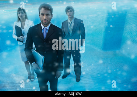 South American businesspeople in swimming pool Stock Photo