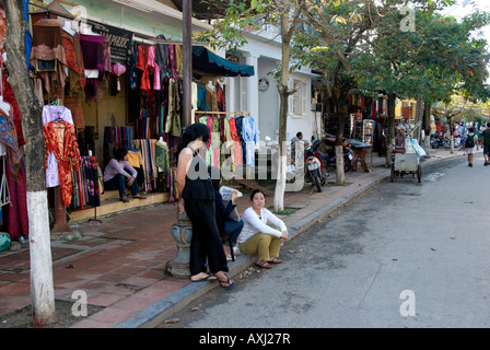 Street scene in Hoi An Vietnam showing shop selling clothing made principally from silk. Pedestrian-friendly Stock Photo