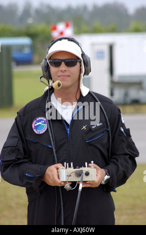 Guy Dekel of the Israeli army pilots an unmanned aerial vehicle (UAV) with radio control equipment, flying over Singapore. Stock Photo