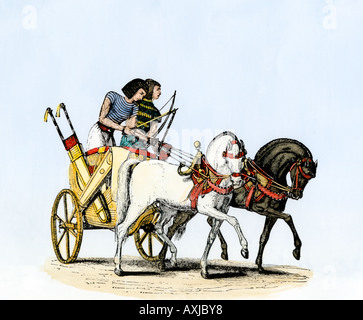Chariot drawn by two horses in ancient Egypt. Hand-colored woodcut Stock Photo