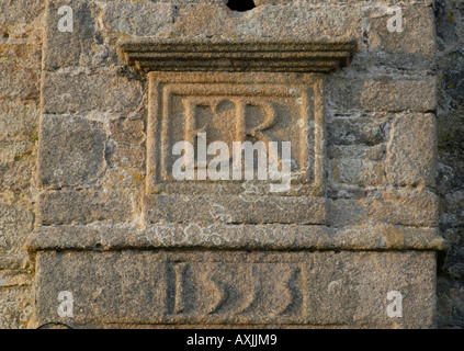 A carved granite block set in the walls of the Star Castle in the Garrison above Hugh Town Stock Photo