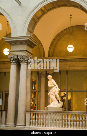 ILLINOIS Chicago Sculpture on grand staircase landing interior of Art Institute of Chicago paintings hanging in gallery