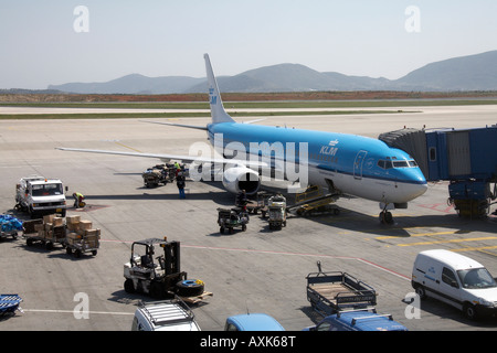 KLM Royal Dutch Airlines Boeing 737 9K2 on the apron by jetty with ground servicing handling at Eleftherios Venizelos Athens Air Stock Photo