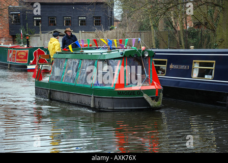 Short narrowboat Maggie G canal boat giving rides near Arthur s Bridge in heavy rain at the Woking canal festival 2008 Stock Photo