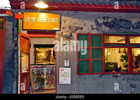 Beijing CHINA, Old Traditional Hutong Neighborhood Lit up at Night 'Here Cafe' on 'Nanluogu Xiang' St Near Houhai Area, Chinese old city Stock Photo