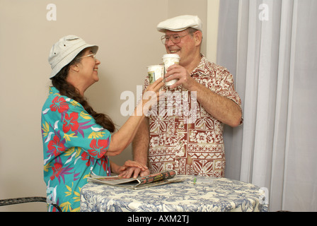 Couple Toasting with Coffee Cups Stock Photo