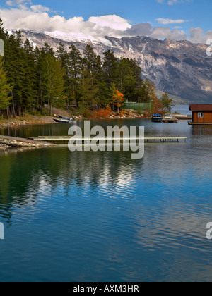 Boats and yachts on a mooring of northern lake in the beginning of autumn Stock Photo
