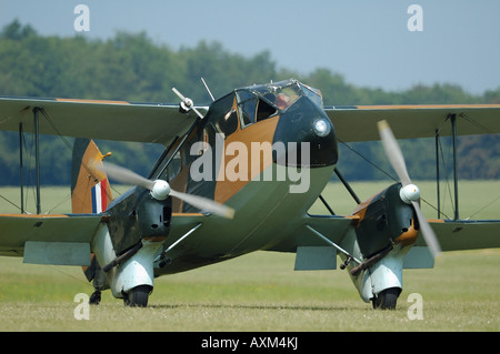 Old 30's British transport biplane De Havilland DH-89 Dragon Rapide, french vintage air show, La Ferte Alais, France Stock Photo