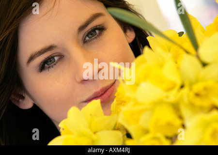 Girl with daffodils Stock Photo