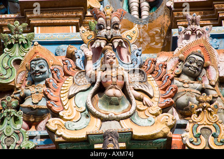 Carved Hindu figures on a gopuram, Meenakshi Temple, Madurai, Tamil Nadu, India Stock Photo