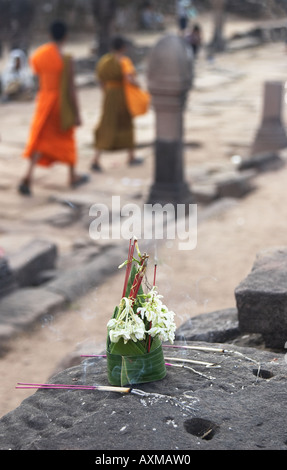 Offerings At Wat Phu Champasak With Monks In Background Stock Photo