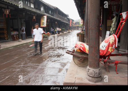 Man Walking Down Old Street In Huanglongxi, Sichuan, China Stock Photo