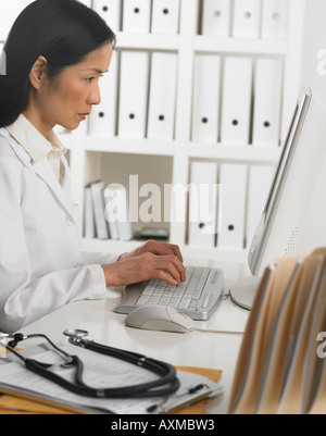 Female doctor using computer Stock Photo