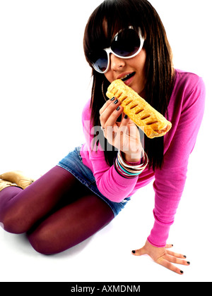 Teenage Girl Eating Sausage Roll Model Released Stock Photo