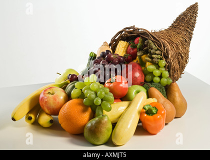 Fruits and vegetables in cornucopia basket Stock Photo