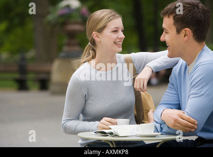 Couple having coffee at outdoor café Stock Photo