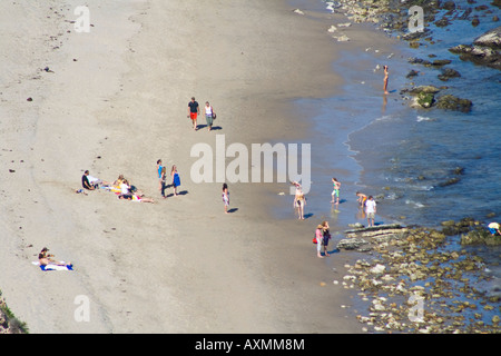 Bathers on the beach in Malibu, CA Stock Photo