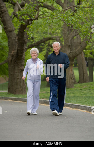 Senior couple powerwalking in park Stock Photo