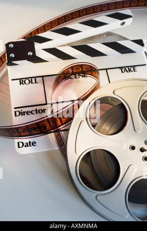 Movie reel with film and clapboard Stock Photo